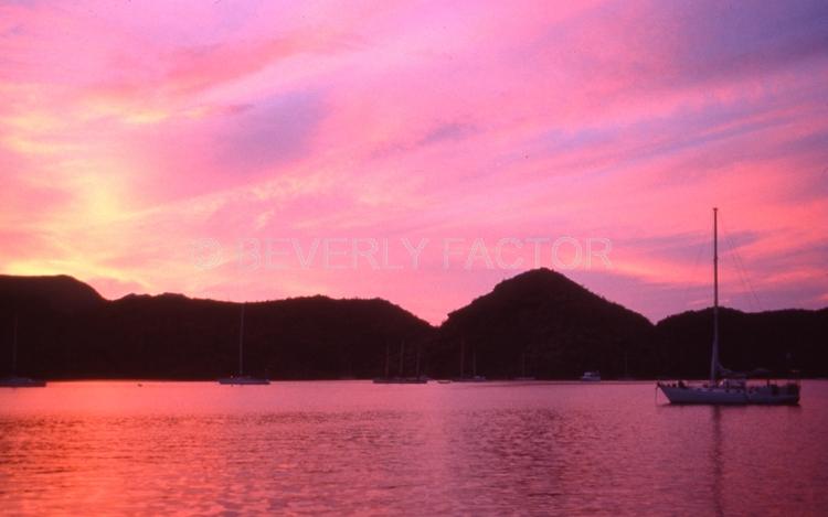 Islands;Sky;sunset;clouds;yellow;sea of cortez mexico;water;red;pink;sillouettes;colorful;sailboats;anchorages